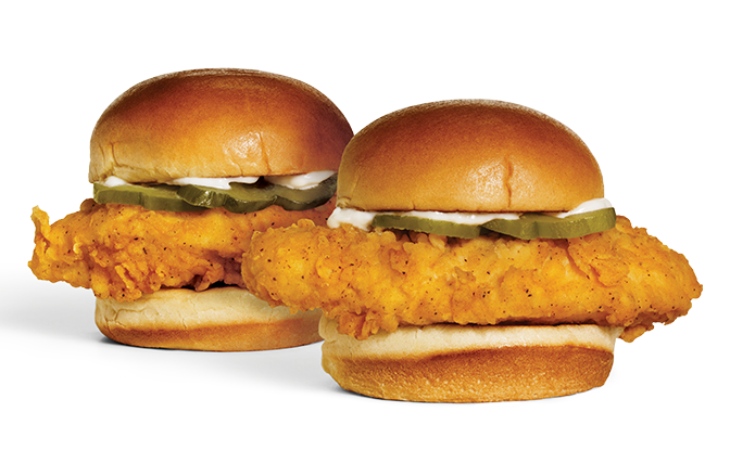 Two Chicken Sliders side-by-side. Each Slider contains chicken, pickles, and 
