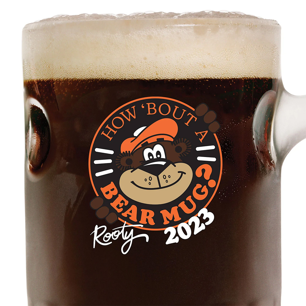 Mug of A&W Root Beer with art of Rooty on front and text above that says "How bout a bear mug?"