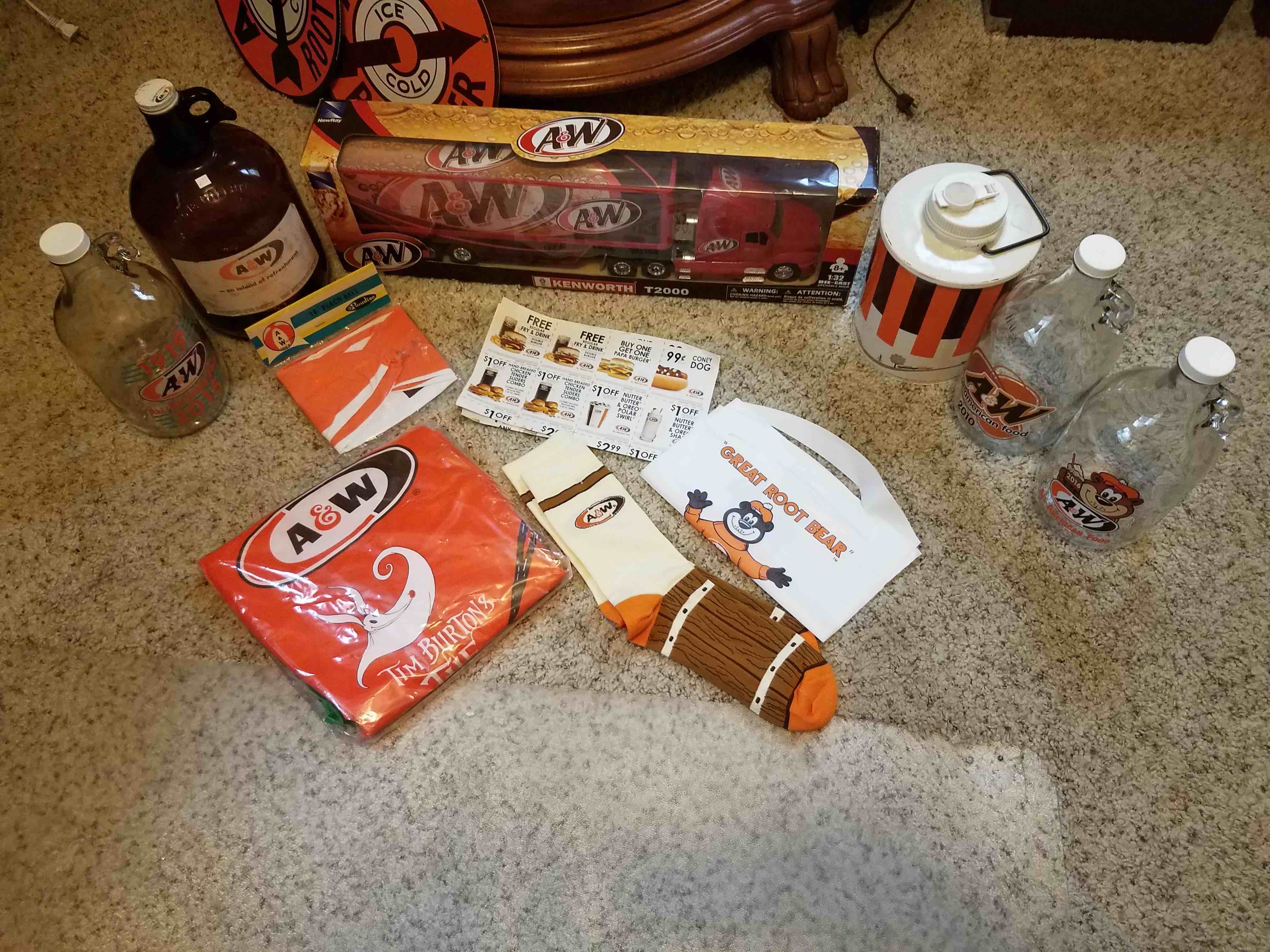 Overheard photo of various A&W Restaurants memorabilia from over the years.
