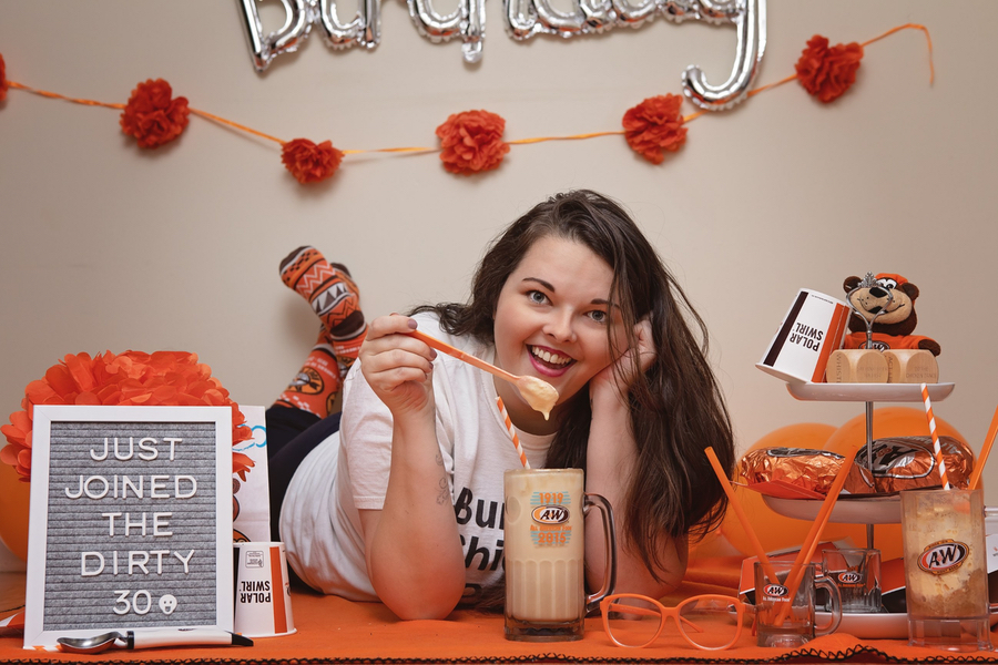 Briana with root beer float in A&W Restaurants mug