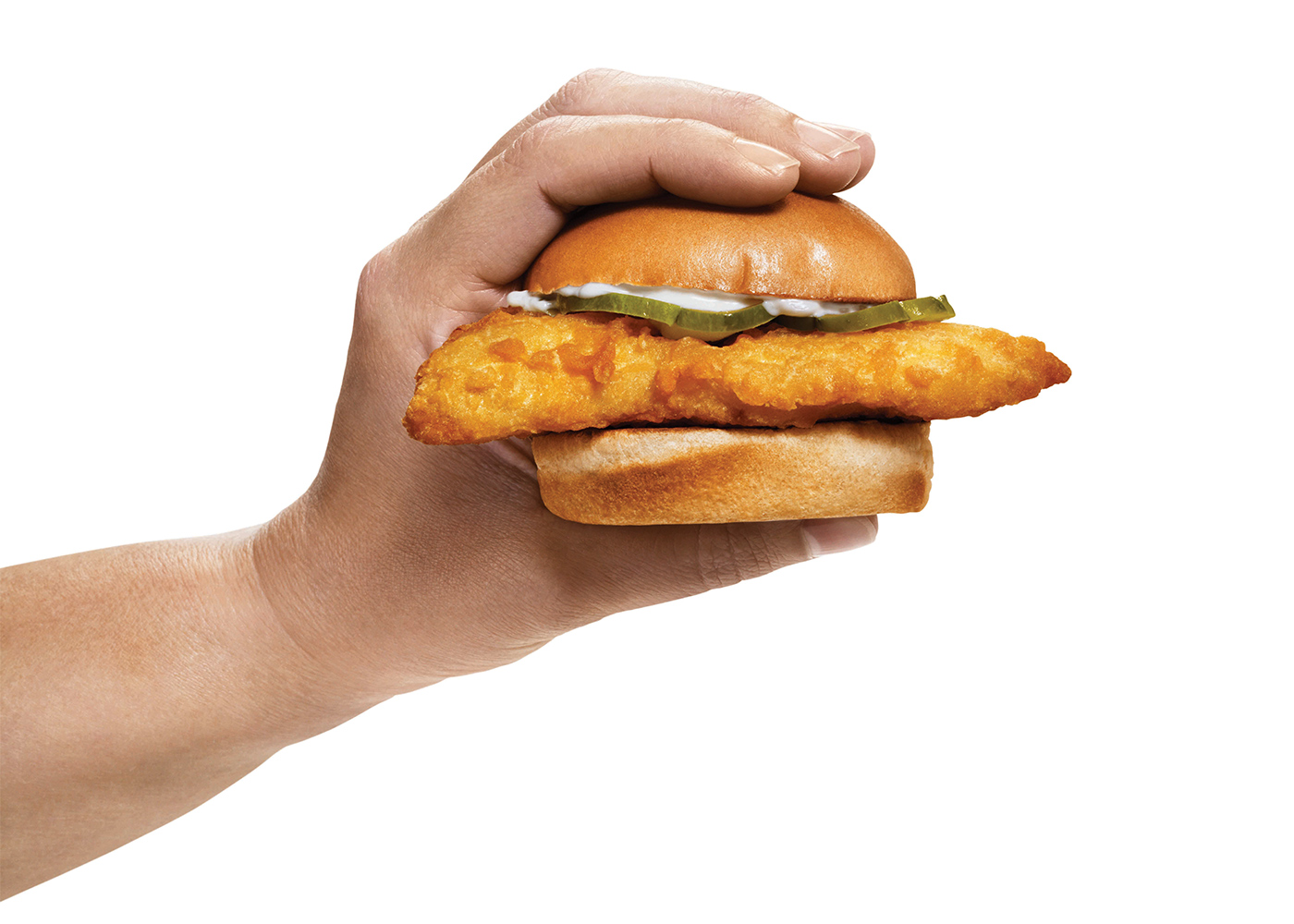 Photo of a person's hand holding an A&W Cod Slider.