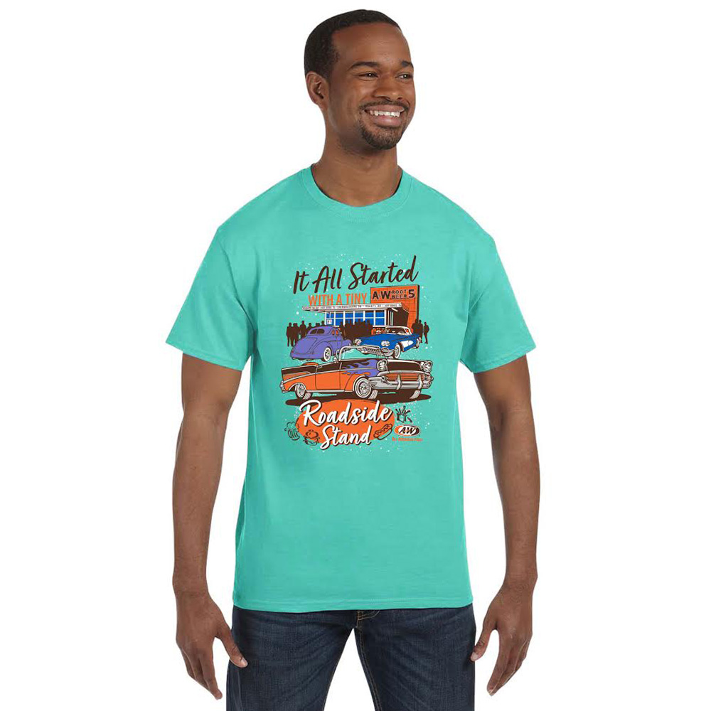 Photo of a man who is wearing a light blue t-shirt. Artwork in the center of the show featuring classic cars in front of an A&W Restaurant. Text above the artwork reads "It All Started". Text below the artwork reads "With a Roadside Stand"