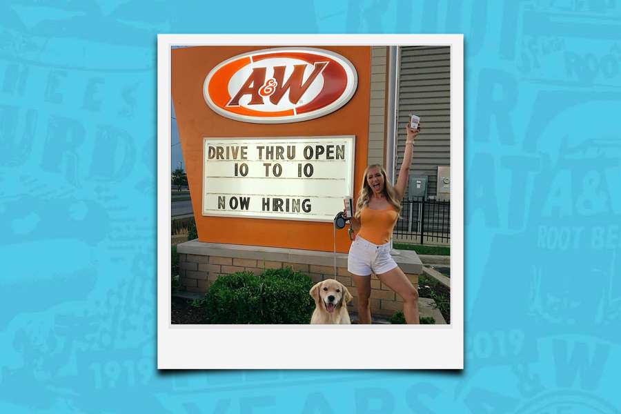 Background is blue. Polaroid of Tara Rushmer in front of A&W Restaurant holding a box of Cheese Curds in the air