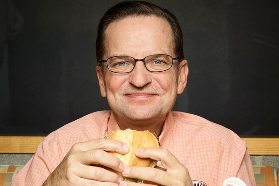 Kevin Bazner holding an A&W burger