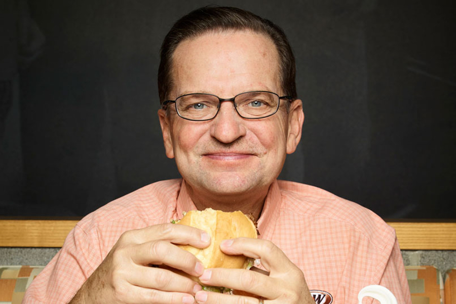Kevin Bazner holding an A&W Burger