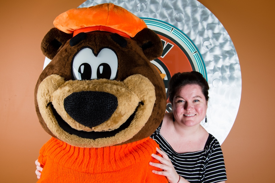 Photo of Liz Bazner posing with Rooty the Great Root Bear