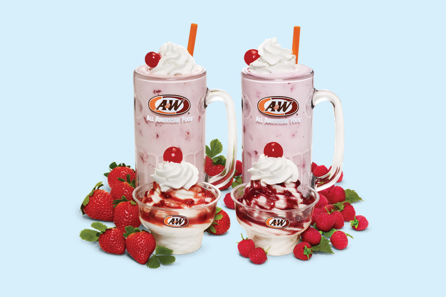 The background is light blue. Photo of a Strawberry Shake and Strawberry Sundae are on the left side of the image surrounded by real strawberries. Photo of a Raspberry Shake and Raspberry Sundae are on the right side of the image surrounded by real raspberries.