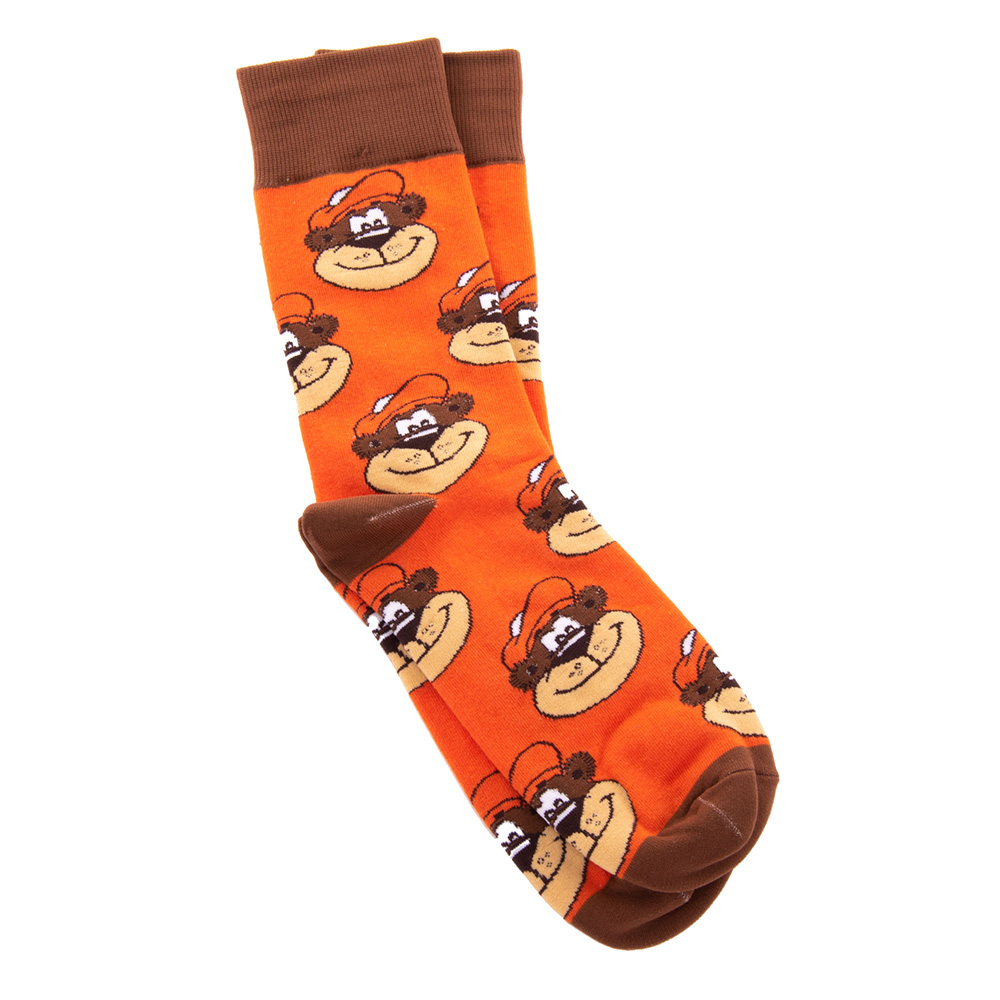 Socks are orange with brown accents on the top and bottom. Artwork of Rooty the Great Root Bear's head is printed all over the socks.