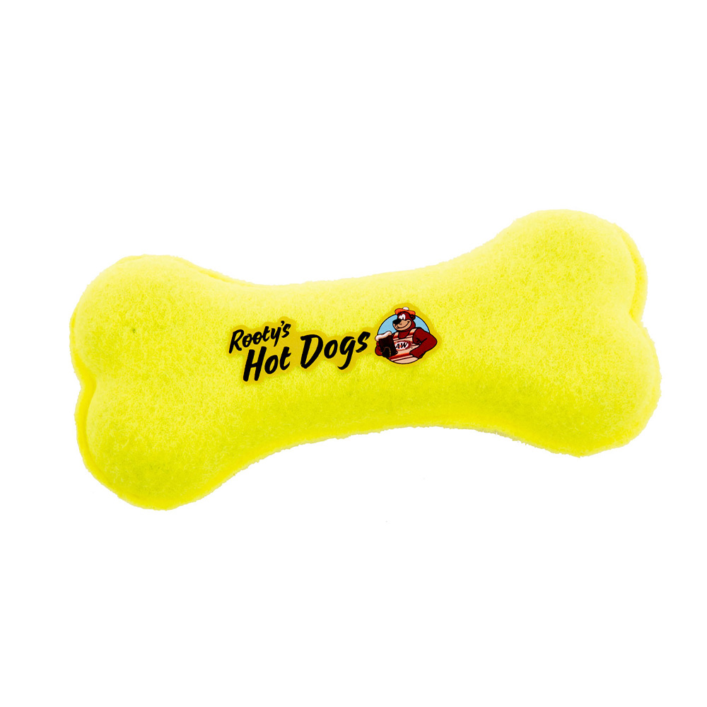 Neon yellow dog bone-shaped tennis ball. Text in the center of the bone reads "Rooty's Hot Dogs". Artwork of Rooty the Great Root Bear is on the right side of the text.