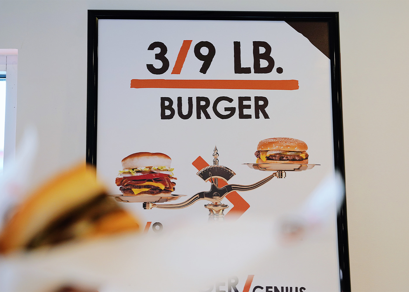 Photo of a 3/9 lb. Burger poster inside an A&W Restaurant. 